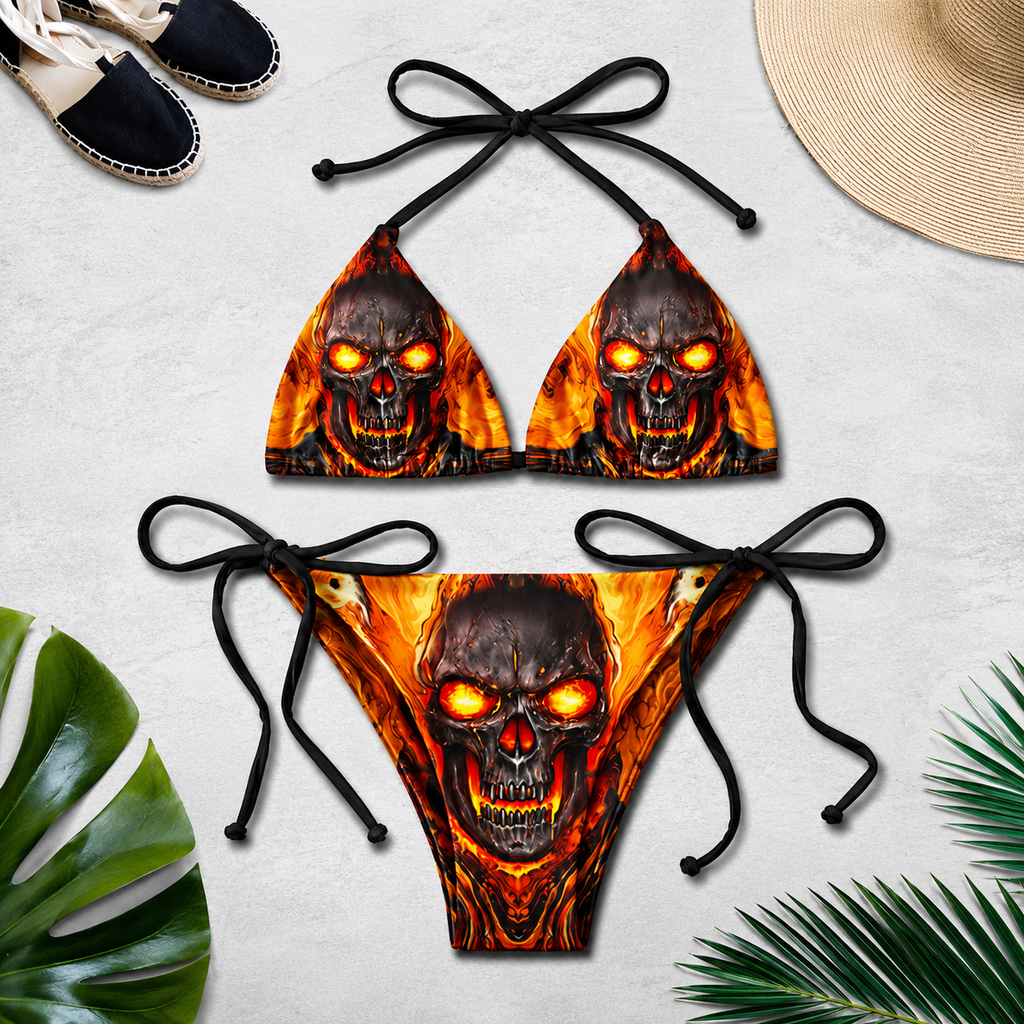 Women's 3D print bikini set flat lay with fire skull and glowing red eyes graphic on orange flame background with tropical leaves – YLR Essentials