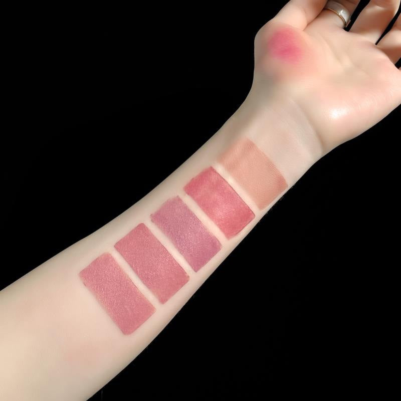 Model wearing a bold red shade from the 5-in-1 matte lipstick