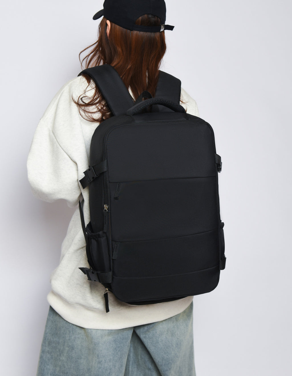 "Large capacity travel backpack with laptop compartment, adjustable shoulder straps, and multi-pocket organization for travel, work, and school"
